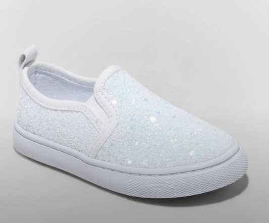 White slip-on sneaker with glittery texture on a light gray background