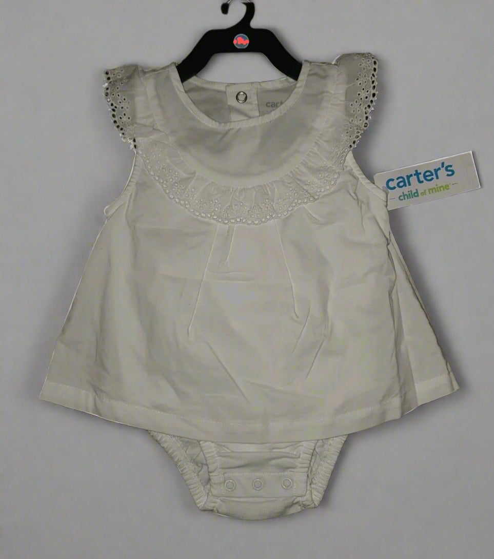 White baby romper with lace collar on a dark background, featuring a Carter's label.