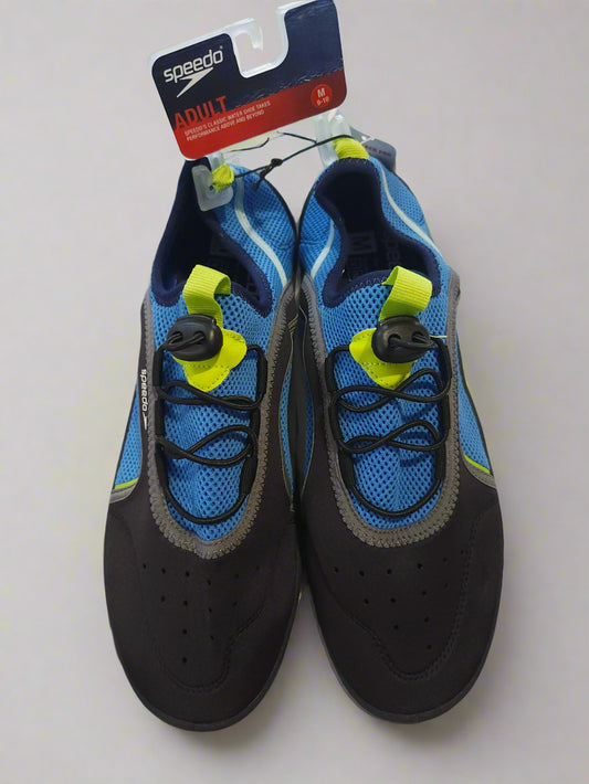 Pair of blue and black water shoes with yellow straps on a white background, featuring Speedo branding.