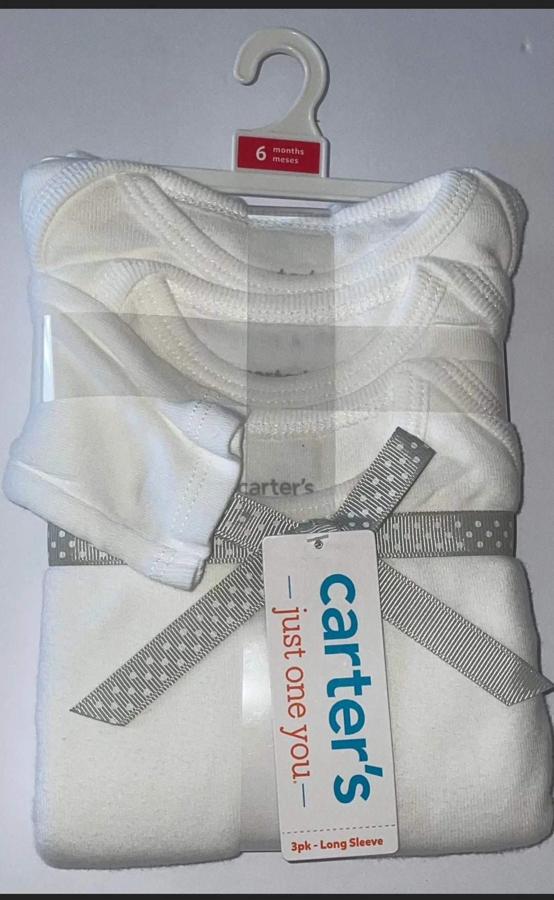 Baby outfit with a Carter's tag on a white background